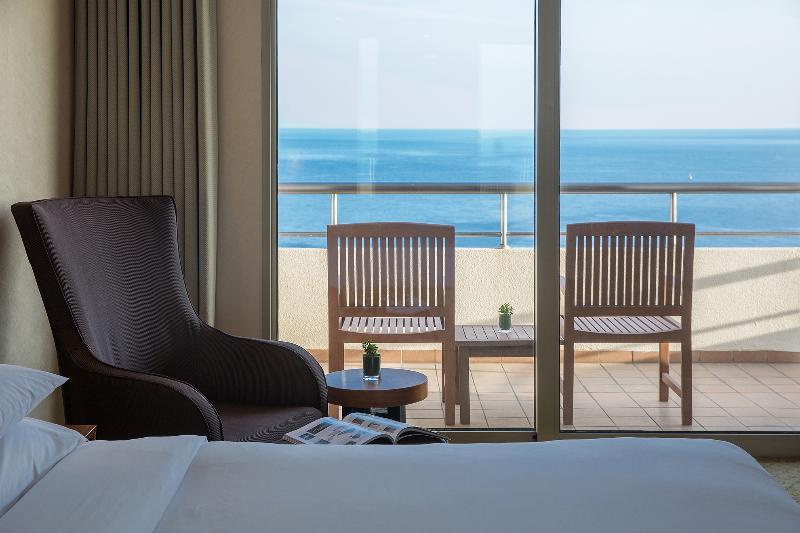 Parnas Hotel Jeju Seogwipo Exterior photo A room at the hotel